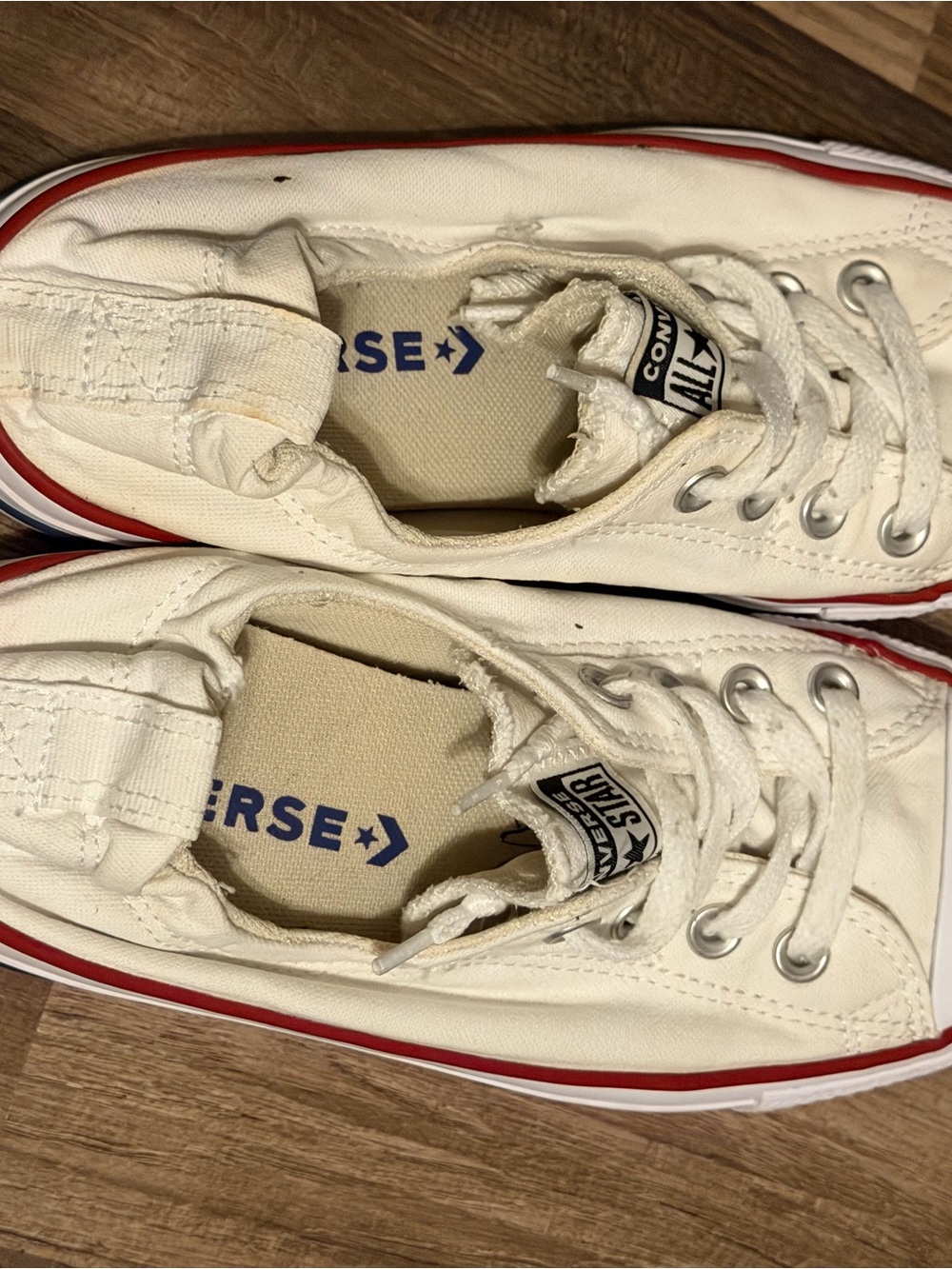Converse White Low-Top Sneakers with Red Trim and Blue Insole Logo